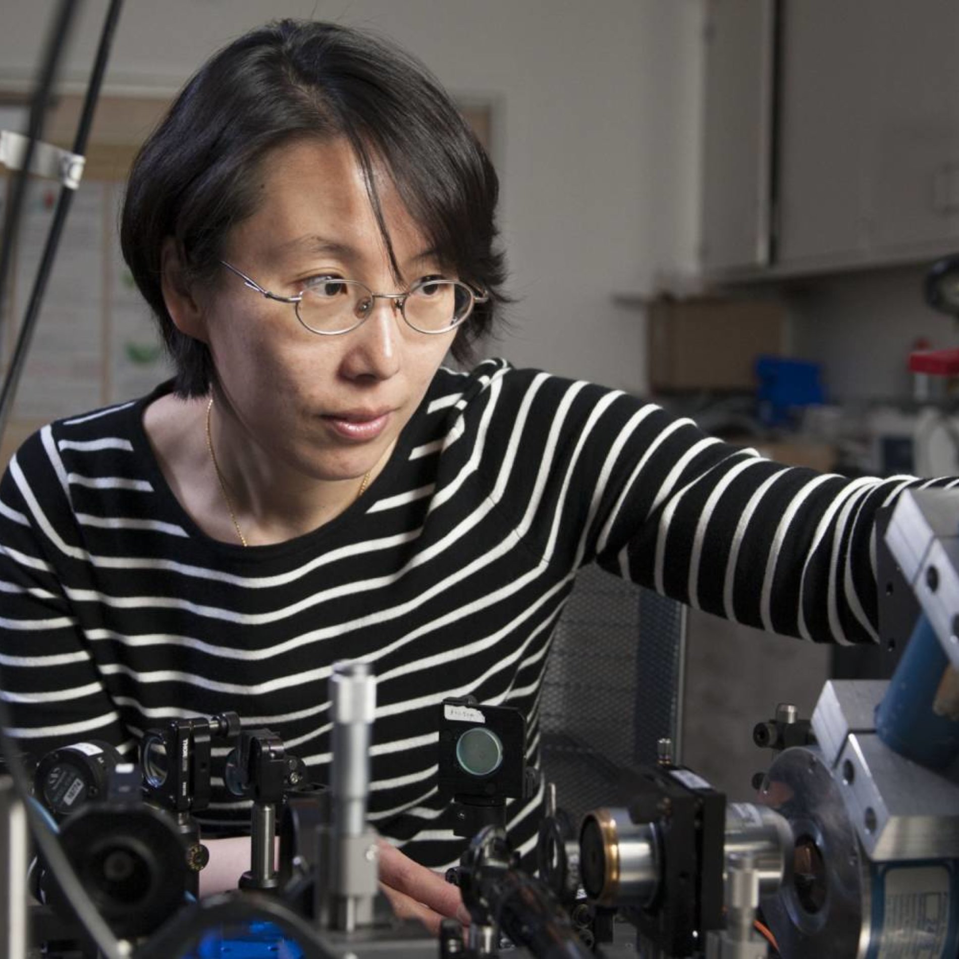 Woman working in laser lab